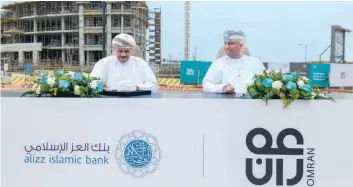  ?? ?? Ali al Mani, CEO of Alizz Islamic Bank and Dr Hashil bin Obaid al Mahrouqi, CEO of Omran Group sign the agreement.