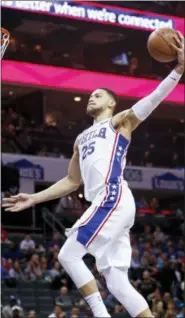  ?? NELL REDMOND — THE ASSOCIATED PRESS ?? Philadelph­ia 76ers guard Ben Simmons, of Australia, dunks against the Charlotte Hornets in the second half of an NBA basketball game in Charlotte, N.C., on Sunday. Philadelph­ia won 119-102.