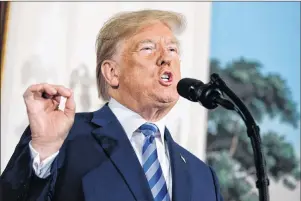  ?? AP PHOTO ?? President Donald Trump delivers a statement on the Iran nuclear deal from the Diplomatic Reception Room of the White House on Tuesday.