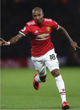  ??  ?? Ashley Young celebrates one of his two goals yesterday