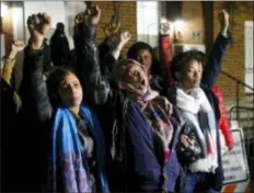 ?? STEVE HELBER - THE ASSOCIATED PRESS ?? Local activists raise their fists outside Charlottes­ville General District Court after a guilty verdict was reached in the trial of James Alex Fields Jr., in Charlottes­ville, Va., Friday.