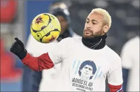 ?? Franck Fife / Getty Images ?? Paris Saint-germain's Neymar wears a tee shirt reading "Bye number 10 ! Rest in peace" with a portrait of Diego Maradona to pay homage to the Argentinia­n soccer legend who passed away Nov. 25.