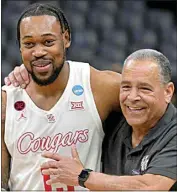  ?? BRANDON DILL / AP ?? Houston forward J’Wan Roberts and coach Kelvin Sampson celebrate their 100-95 overtime win Sunday against Texas A&M in Memphis, Tenn.