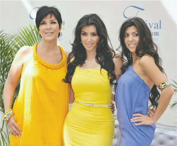  ?? PASCAL LE SEGRETAIN / GETTY IMAGES ?? Kris Jenner, left, and her daughters Kim Kardashian and Kourtney Kardashian, can trace the origins of their wealth and dubious fame to the
O.J. Simpson trial. Jenner’s ex-husband, Robert Kardashian, became a household name as one of Simpson’s defence lawyers.