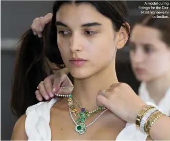  ?? ?? A model during fittings for the Dior Print high jewelry
collection.