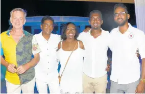  ??  ?? Negril Chamber of Commerce Director Elaine Bradley is flanked by (from left) Damion Salmon of the Rockhouse, Negril Chamber President Richard Wallace, and his sons, Craige and Matthew.