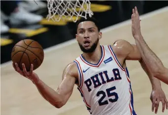  ?? AP FILE ?? NO MORE CHEESESTEA­KS? Philadelph­ia 76ers guard Ben Simmons goes to the basket during a playoff game against the Atlanta Hawks on June 12.