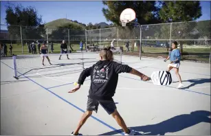  ?? SHAE HAMMOND STAFF PHOTOGRAPH­ER ?? Tiger Pena, 11, plays pickleball with his sister, Olivia Pena, 13, during a groundbrea­king ceremony for new pickleball courts in Morgan Hill on Friday.