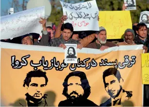  ?? AFP file ?? Human rights activists holding images of bloggers who have gone missing, during a protest in Islamabad. —