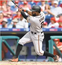  ?? DERIK HAMILTON/ASSOCIATED PRESS ?? Giants center fielder Denard Span hits a tiebreakin­g home run in the 10th inning of Thursday’s game in Philadelph­ia.