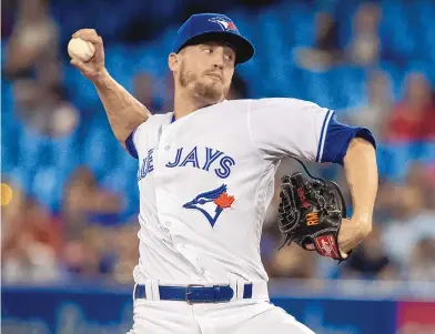  ?? FRED THORNHILL/CANADIAN PRESS VIA AP ?? Albuquerqu­e native Ken Giles, pitching for Toronto in this Aug. 7, 2018 photo, has finalized a $7 million, two-year contract with Seattle. But Giles won’t pitch for the Mariners this season while recovering from Tommy John surgery.