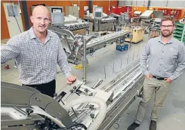  ?? Photo: MARK TAYLOR/ FAIRFAX NZ ?? A fast-packing machine that can be used for blueberrie­s made BBC Technologi­es a finalist in three categories of the NZ Innovators Awards. Pictured are chief executive Geoff Furniss, left, and sales and marketing manager Jason Walker.