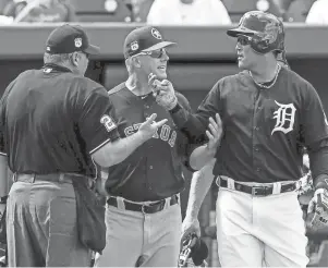  ?? BUTCH DILL/USA TODAY ?? The Tigers’ Miguel Cabrera reacts with former Astros and now Tigers manager A.J. Hinch and umpire Hunter Wendelsted­t, after Cabrera was hit by a pitch in 2017.
