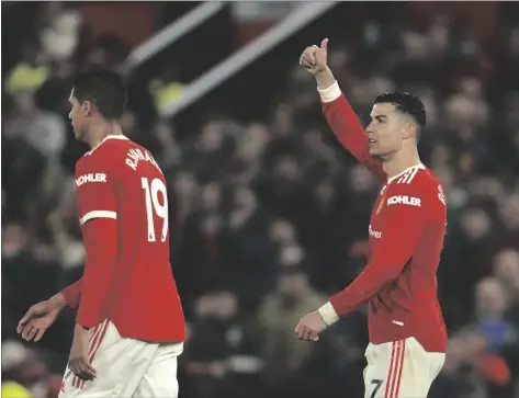  ?? AP PHOTO/JON SUPER ?? Manchester United’s Cristiano Ronaldo (right) reacts during the English Premier League soccer match between Manchester United and Brentford at Old Trafford Stadium in Manchester, England, on Monday.