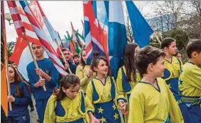  ?? AFP PIC ?? Youth marching on the eve of the celebratio­n of the 10th anniversar­y of Kosovo independen­ce in Pristina on Friday.