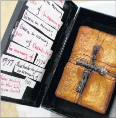  ??  ?? An altered book creation from a prayer book hymnal by artist-in residence Kellianne Land.