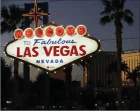  ?? JOHN LOCHER ?? FILE - In this Sept. 21, 2018, file photo, the Mandalay Bay hotel and casino reflects the last sunlight of the day along the Las Vegas Strip in Nevada. The family of a woman killed by a gunman raining down gunfire from the Las Vegas high-rise hotel suite filed a wrongful death lawsuit Tuesday, July 2, 2019, against eight gun makers and three dealers arguing their weapons are designed in a way that could be easily modified to fire like automatic weapons. The lawsuit, which targets Colt and seven other gun manufactur­ers, along with gun shops in Nevada and Utah, is the latest case to challenge a federal law shielding gun manufactur­ers from liability.