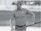  ?? PHOTOS BY THE ASSOCIATED PRESS ?? Webb Simpson, left, and Alex Noren shared the lead after the first day of competitio­n at PGA National. Each shot a 4-under-par 66 on the Champion Course despite windy conditions.