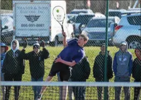  ?? AUSTIN HERTZOG - DIGITAL FIRST MEDIA ?? Phoenixvil­le’s Andy Holmberg serves against Spring-Ford’s Adit Jain in the third set at No. 3 singles Thursday.