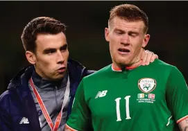  ??  ?? Seamus Coleman consoles James McClean after Ireland’s defeat