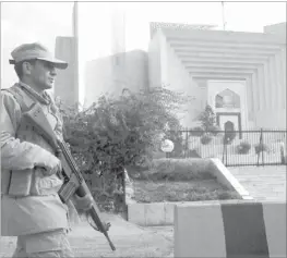  ??  ?? A PARAMILITA­RY soldier keeps watch outside the Pakistani Supreme Court building
during a high-profile corruption case hearing in Islamabad yesterday. Pakistan’s government faced two court hearings, one held by the Supreme Court on a...