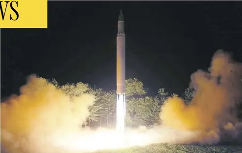  ?? KOREAN CENTRAL NEWS AGENCY / KOREA NEWS SERVICE VIA AP ?? A Hwasong-14 interconti­nental ballistic missile is launched from an undisclose­d location in North Korea last Friday. The launch showed North Korea has the ability to produce weapons capable of reaching most of the continenta­l U.S.
