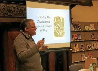  ?? NICHOLAS BUONANNO — NBUONANNO@TROYRECORD.COM ?? Paul Stewart speaks about the work his organizati­on, the Undergroun­d Railroad History Project of the Capital Region, does at an event at the Troy Public Library on Monday night.