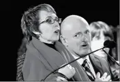  ?? ASSOCIATED PRESS ?? IN THIS 2012 FILE PHOTO, Rep. Gabrielle Giffords (left) leads the Pledge of Allegiance with by her husband, former astronaut Mark Kelly, at the start of a memorial vigil.