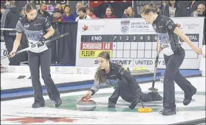  ?? TRURO NEWS PHOTO ?? Skip Kaitlyn Jones delivers a rock with with Karlee Burgess, left, and Lindsey Burgess at the ready to begin sweeping duties.