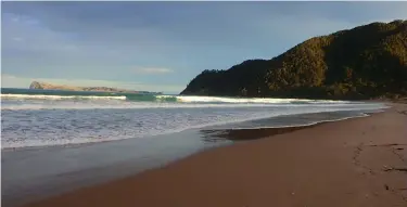  ??  ?? Evening light at Whangamata Surf Beach.