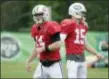  ?? SETH WENIG — THE ASSOCIATED PRESS ?? Jets’ quarterbac­ks Sam Darnold, left, and Josh McCown participat­e during practice at the NFL football team’s training camp in Florham Park on Monday.