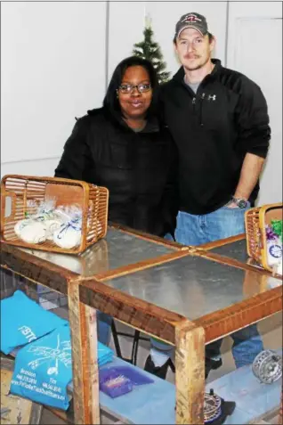  ?? TAWANA ROBERTS — THE NEWS-HERALD ?? Bruce Norfolk and Latanya Coston recently opened Drifters Fly and Bait Shop at 218 E. Main St. in Painesvill­e.