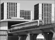  ?? WANG ZHUANGFEI / CHINA DAILY ?? A maglev train on Beijing’s S1 Line makes a trial run on Wednesday. The line is expected to open to passengers by the end of this year.