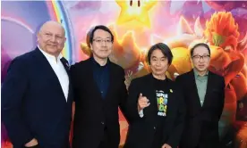  ?? Photograph: Valérie Macon/ AFP/Getty Images ?? Ground Theme Nintendo music composer Koji Kondon, right, with other team members at Universal’s The Super Mario Bros Movie special screening.