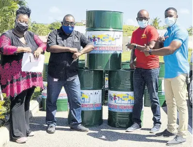  ?? CONTRIBUTE­D ?? (From left) Janique Harris, president of the Meadows of Irwin Citizens Associatio­n; Shaun Hall, president-elect of the Meadows of Irwin Citizens Associatio­n; Garnet Edmondson, regional operations manager, Western Parks and Market Waste Management Limited; and Councillor Richard Vernon, deputy mayor of Montego Bay. They were at last Friday’s launch of a plastic separation drive.