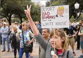  ?? JAY JANNER / AMERICAN-STATESMAN ?? Jaime Shimkus participat­es in the Not My President rally at the Capitol on Feb. 20. As he marks 100 days in office, President Donald Trump is wrangling with issues from immigratio­n to a proposed border wall in Mexico.