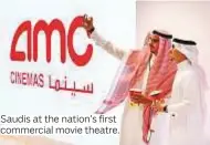  ?? Photos by AP and Reuters ?? Saudis at the nation’s first commercial movie theatre.