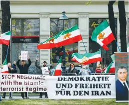  ?? (Leonhard Foeger/Reuters) ?? IRANIAN OPPOSITION activists protest outside during a meeting of the Joint Commission of the JCPOA in Vienna on Tuesday.