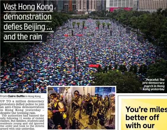  ??  ?? Mob-handed: Riot police in Mong Kok, Hong Kong Peaceful: The pro-democracy march in Hong Kong yesterday