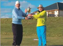  ?? ?? Brian Sherwood, right, presents Quintin Oliver of Lochranza Golf Club with the Alistair MacVicar Trophy played at Shiskine Golf Club last weekend.