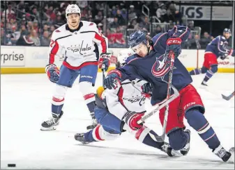  ?? [TYLER SCHANK/DISPATCH] ?? Blue Jackets left wing Artemi Panarin is tripped by Capitals defenseman Jonas Siegenthal­er in the third period.