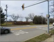  ?? DAN SOKIL - MEDIANEWS GROUP ?? Cars drive past a crosswalk on Allentown Road in Towamencin leading to Walton Farm Elementary School where a parent has asked the township to investigat­e speeding and possible safety upgrades.