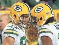  ?? TODAY NETWORK-WISCONSIN JIM MATTHEWS/USA ?? Green Bay Packers wide receiver Jordy Nelson (left) gets a helmet bump from wide receiver Davante Adams after a long reception Thursday against the Chicago Bears at Lambeau Field. Adams returned to practice Wednesday after being hospitaliz­ed from a hit...