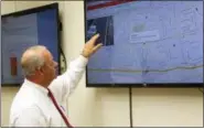  ?? AP PHOTO—MICHAEL BALSAMO ?? In this Nov. 19photo, Freeport Mayor Robert Kennedy demonstrat­es the village’s license plate scanner system at the Village Hall. Since November, the ring of 27cameras has scanned more than 15.4 million license plates, resulting in 25people being...
