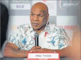  ?? AALOK SONI/HT PHOTO ?? Mike Tyson during an interactio­n on Friday. (Below) Being received at the airport.