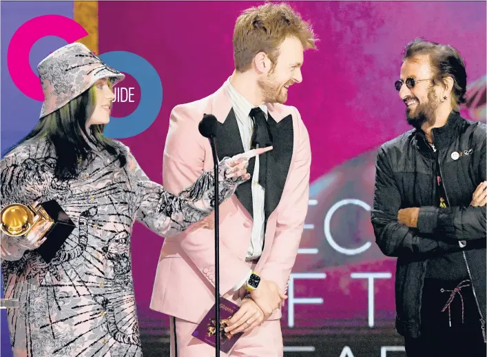  ?? RECORDING ACADEMY KEVIN WINTER/THE ?? Billie Eilish and Finneas, center, accept the record of the year award for “Everything I Wanted” from Ringo Starr during the 63rd annual Grammy Awards on Sunday at the Los Angeles Convention Center.