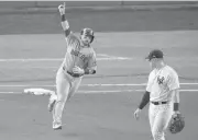  ?? [AP PHOTO] ?? Boston Red Sox’s Christian Vazquez reacts as he rounds first base after connecting for a solo home run against the New York Yankees during the fourth inning of Game 4 of baseball’s American League Division Series on Tuesday in New York.