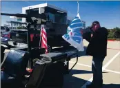  ?? JULIA PRODIS SULEK — STAFF ?? Tim Bero, 58, who left California and Oregon to move to a Fort Worth suburb years ago, drives his Texas convertibl­e, a 1962 U.S.Army Jeep outfitted with a fake machine gun and Trump flags around town on Friday in Fort Worth, Texas.