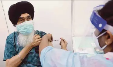  ?? PIC BY MOHD YUSNI ARIFFIN ?? Harcharan Singh getting vaccinated at the World Trade Centre vaccinatio­n centre in Kuala Lumpur yesterday.