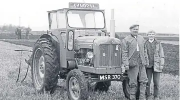  ??  ?? Grange Ploughing Associatio­n hosted a ploughing match at Valgreen, Murroes, in November 1999, which attracted a large entry despite the inclement weather. Pictured beside his Fordson Major tractor is Andrew Younger, winner of the tractor trailing ploughing competitio­n, with his wife Ann.